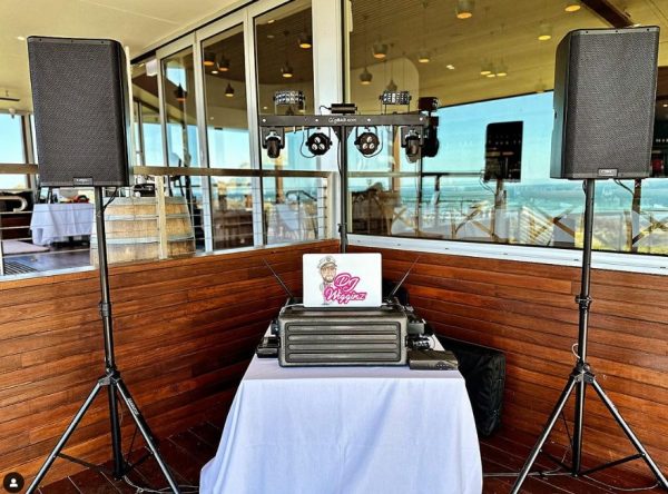 2 speakers on stands at an event